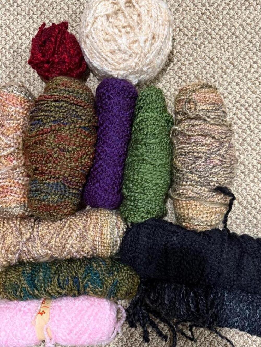 12 skeins of wavy bubble yarn in various colors
